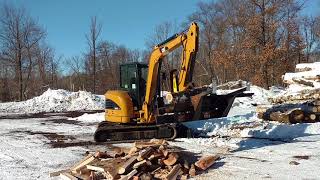 Halverson Firewood Processor on a MiniExcavator [upl. by Aremihc934]