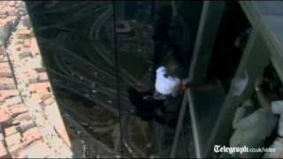 French Spiderman Alain Robert slips off side off building in rare fall [upl. by Esau658]