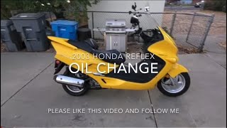 Oil change on a 2003 Honda reflex nss250 [upl. by Eintruoc906]